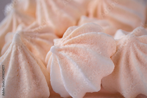 Close up meringue photo. Dessert background. Homemade meringue cookies. photo