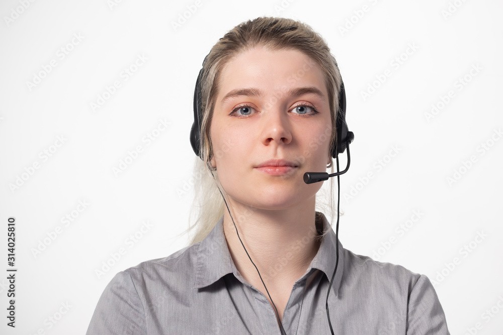 Portrait of attractive business woman with headset isolated over white background with large area for your text. Portrait of attractive business woman with headset isolated over white background with large area for your text.