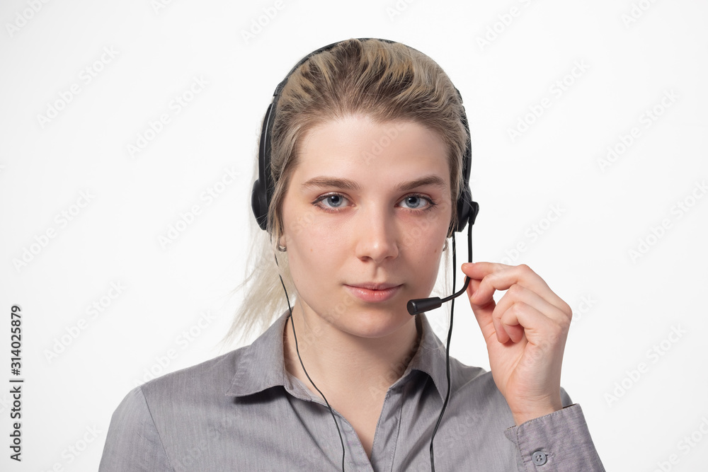 Portrait of attractive business woman with headset isolated over white background with large area for your text. Portrait of attractive business woman with headset isolated over white background with large area for your text.