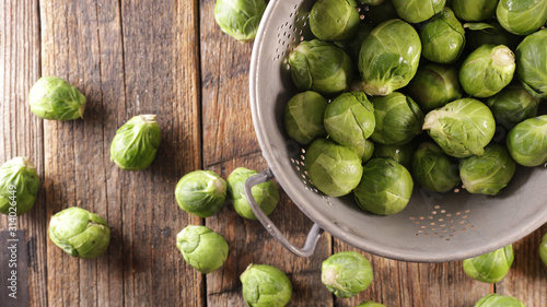 raw brussel sprouts on wood background