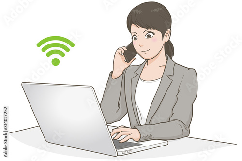 パソコンで仕事をする女性・電話