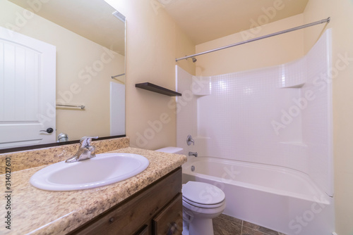 Small modern bathroom interior with marble vanity