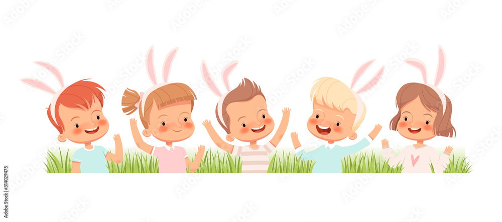 Children dressed in bunnies laugh and wave their hands in the grass. Children congratulate you on Easter. Children dressed in bunnies laugh and wave their hands in the grass. Children congratulate you on Easter.