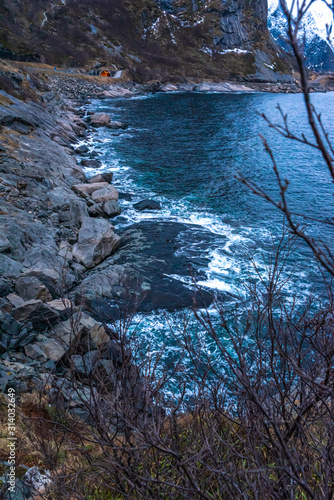 waves on the rocks , northern sea coast, coastline frame, winter blue cold