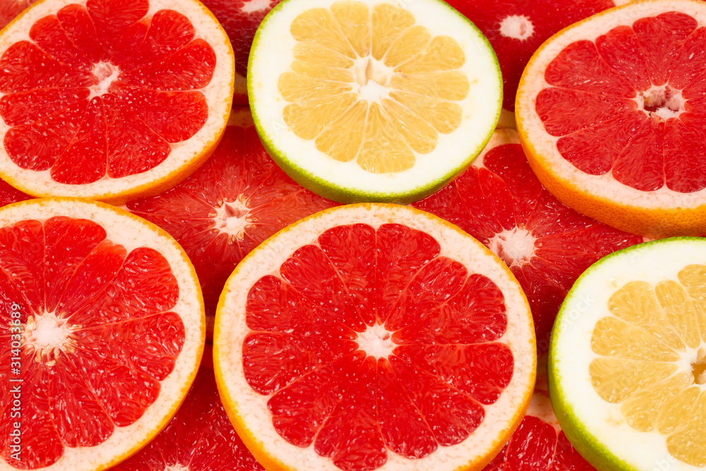 Pomelo and grapefruit slices background. Pomelo and grapefruit slices background.
