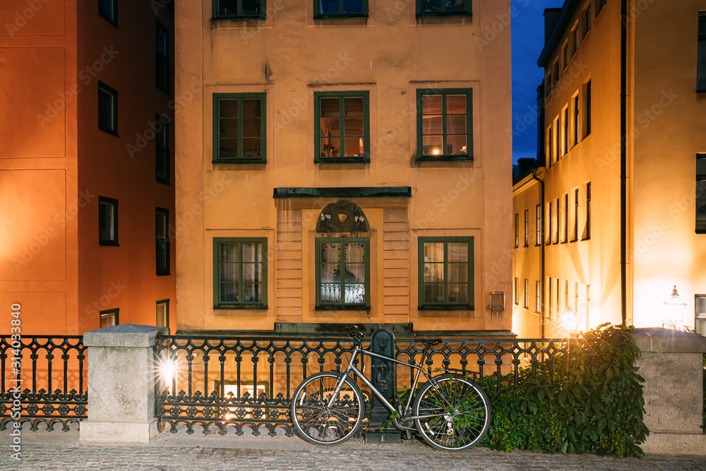 Stockholm, Sweden. Night View Of Traditional Stockholm Street. Residential Area, Cozy Street In Downtown. Osterlanggatan Street In Historical District Gamla Stan. Parked Bicycle Bike In European City