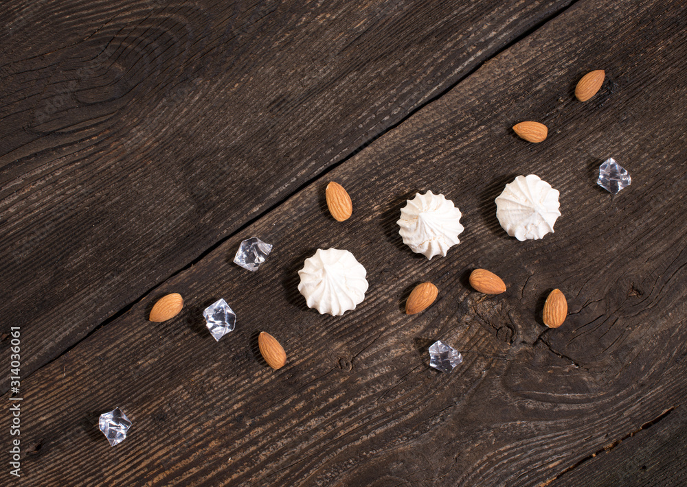 Fotografie Sweets on old wooden plank