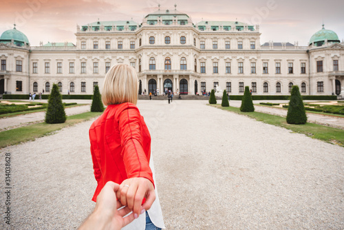 Canvas Print Female traveler on the background of Belvedere Palace complex of the 18th century in Vienna, Austria
