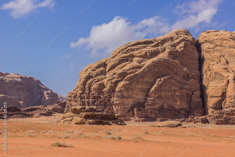 Wadi Rum UNESCO world heritage famous touristic site desert landscape with sand stone rocky mountains picturesque scenic view