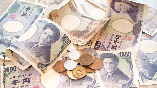 Japanese yen banknotes and Japanese yen coins for background image, vintage tone concept photo