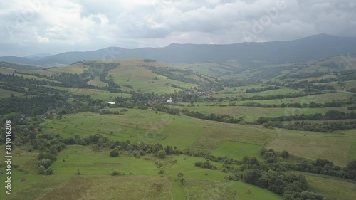 Ukrainian Carpathian mountains in the area of the pass.  Latorka village in a picturesque valley among the hills from a bird's eye view.. Forested hills   photo