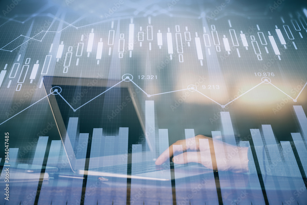 Double exposure of stock market graph with man working on laptop on background. Concept of financial analysis. Double exposure of stock market graph with man working on laptop on background. Concept of financial analysis.