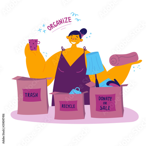 The woman sorts her things and organizes the space.Minimalistic lifestyle concept.A young woman sorts out her unnecessary things and sorts them into boxes - trash, donate or sell, recycle.