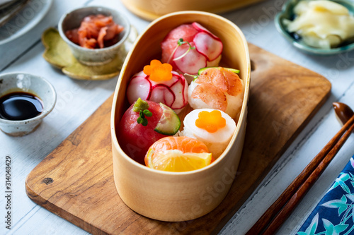 Temari sushi balls with salmon, tuna and vegetables