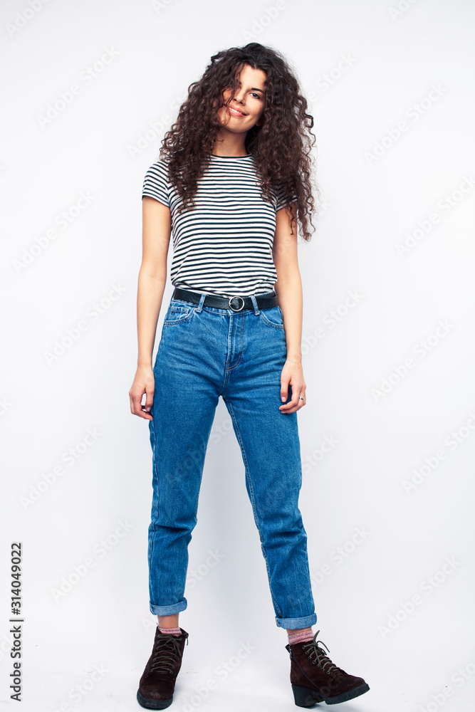 young brunette woman with curly hairstyle in bright casual clothers isolated on white background gesturing happy smiling, lifestyle people concept young brunette woman with curly hairstyle in bright casual clothers isolated on white background gesturing happy smiling, lifestyle people concept