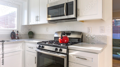 Panorama Stove with red kettle in the kitchen
