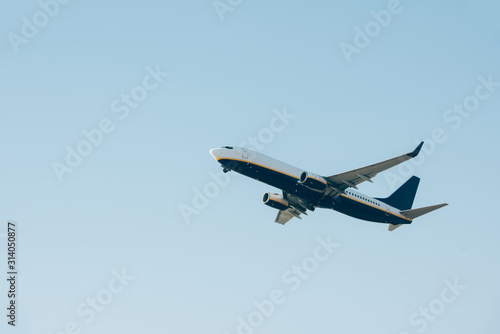 Low angle view of airplane departure in clear sky