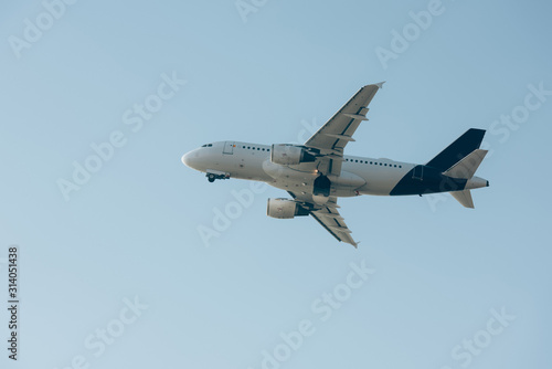 Flight departure of commercial plane in blue sky
