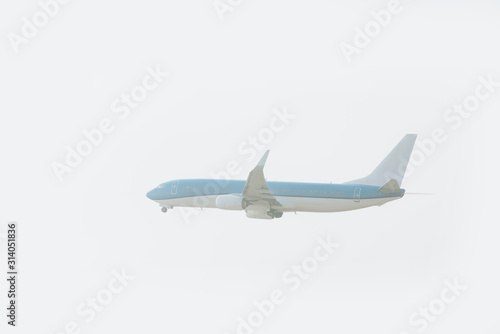 Jet plane landing with cloudy sky at background