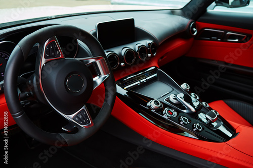 Luxury car Interior. Steering wheel and dashboard.
