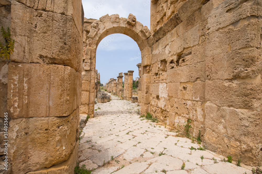 A small arch near the arch of triumph. Roman remains in Tyre. Tyre is an ancient Phoenician city. Tyre, Lebanon - June, 2019