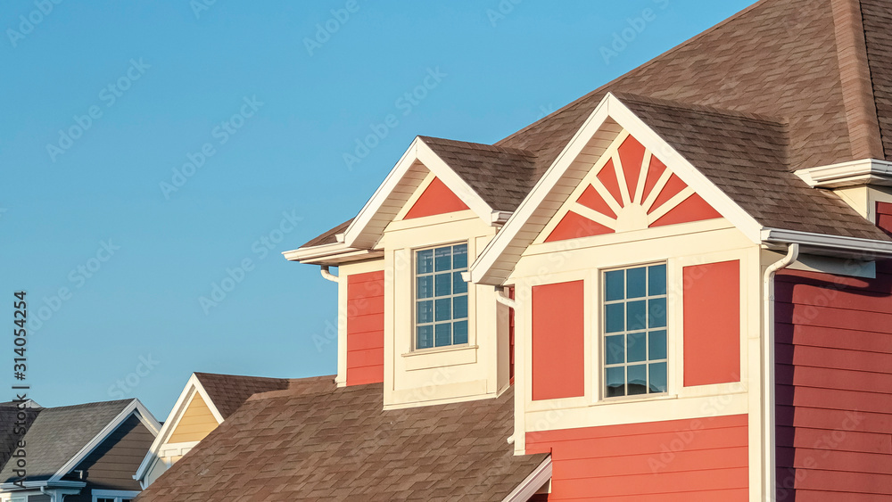 Panorama frame Colourful red timber suburban house near sunrise