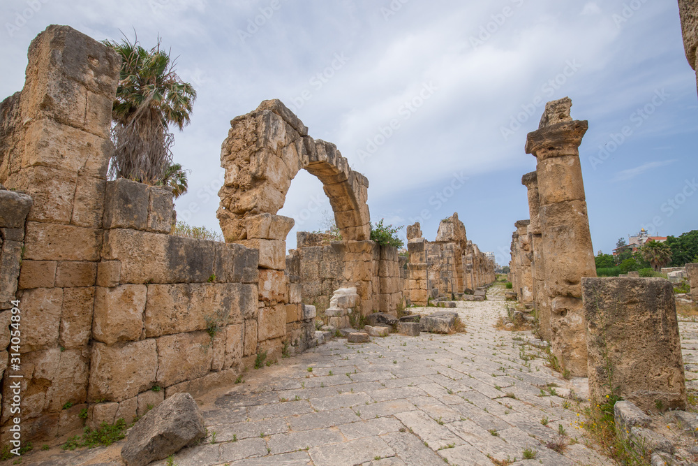 Roman Aqueduct and colonnaded street. Roman remains in Tyre. Tyre is an ancient Phoenician city. Tyre, Lebanon - June, 2019