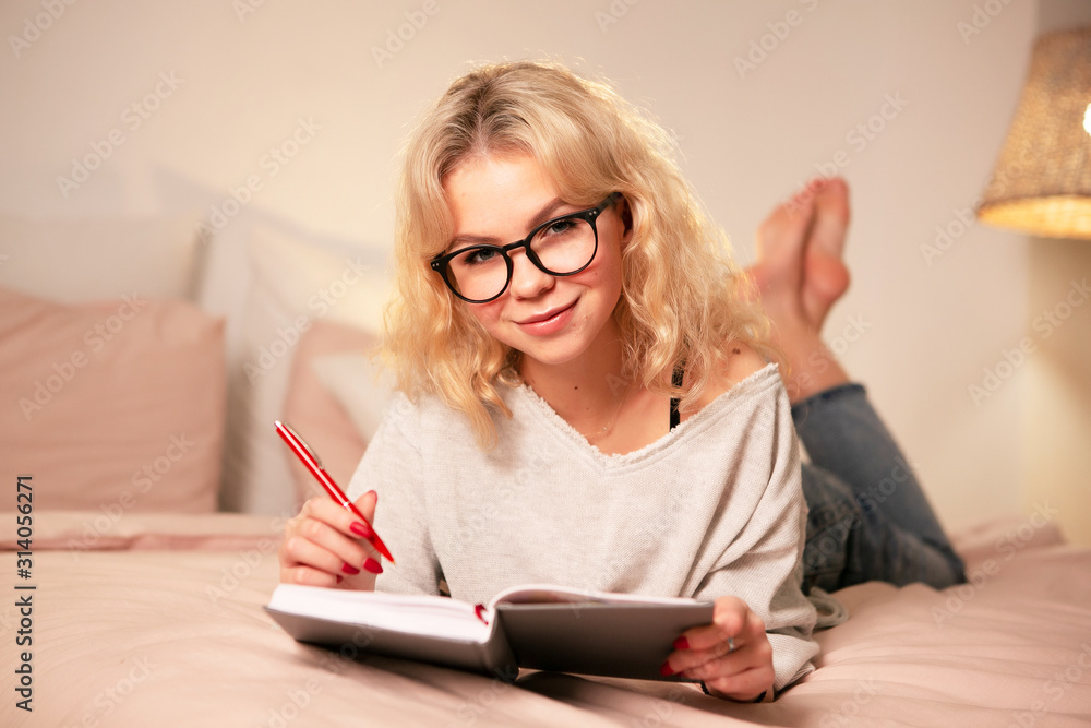 Young woman studying at night at home Young woman studying at night at home