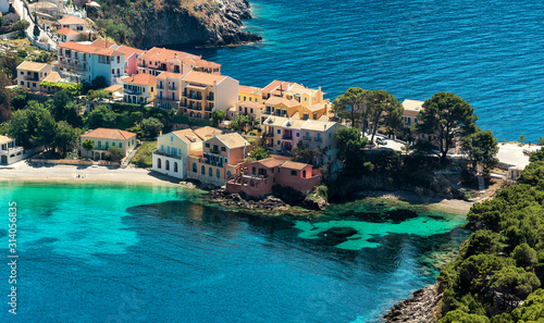 Panoramic spring seascape of Ionian Sea. Wonderful Sunny Day. Beautiful view over the sea beach in Assos village with colorful houses. Kefalonia island. Greece
