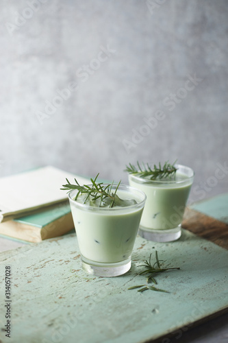 Homemade iced matcha latte tea with milk..