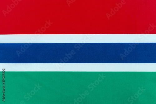 Flag of the Republic of the Gambia on a textile basis close-up © Лозовая Людмила