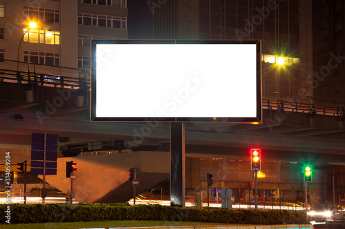 Blank billboard on night street