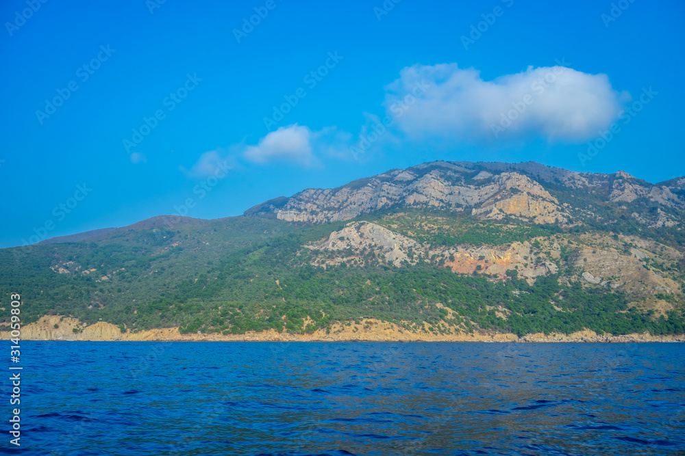 Seascape with views of the mountains near the coastline. Seascape with views of the mountains near the coastline.