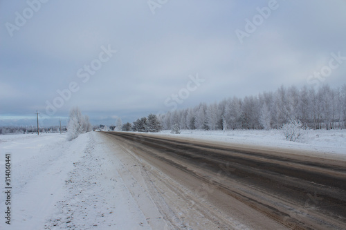 Winter rural road in the Ulyanovsk region in Russia. © NATALIA