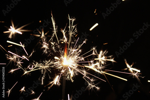 Wallpaper Mural sparkler with sparks on black background Torontodigital.ca