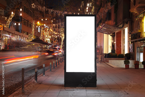 Blank billboard on night street