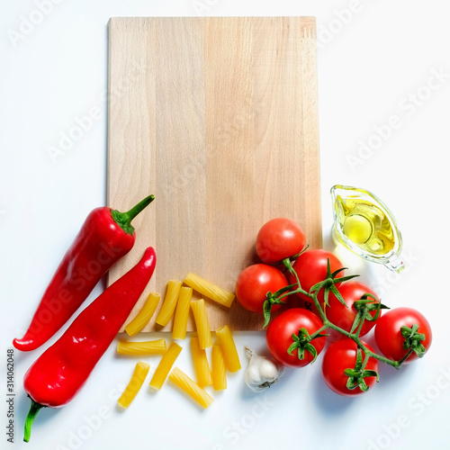Clean healthy eating habits concept. Uncooked pasta, greens & vegetables mix and other vegan macaroni ingredients, white background. Vegetarian diet food. Flat lay, copy space
