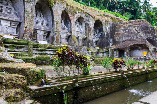 Funeral monuments of king Anak Wungsu of the Udayana dynasty and his favourite queens in Gunung Kawi, 11th-century and funerary complex in Tampaksiring, close to Ubud on Bali island, Indonesia. photo