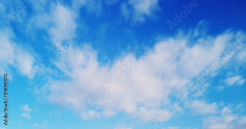 White clouds with blue sky background.