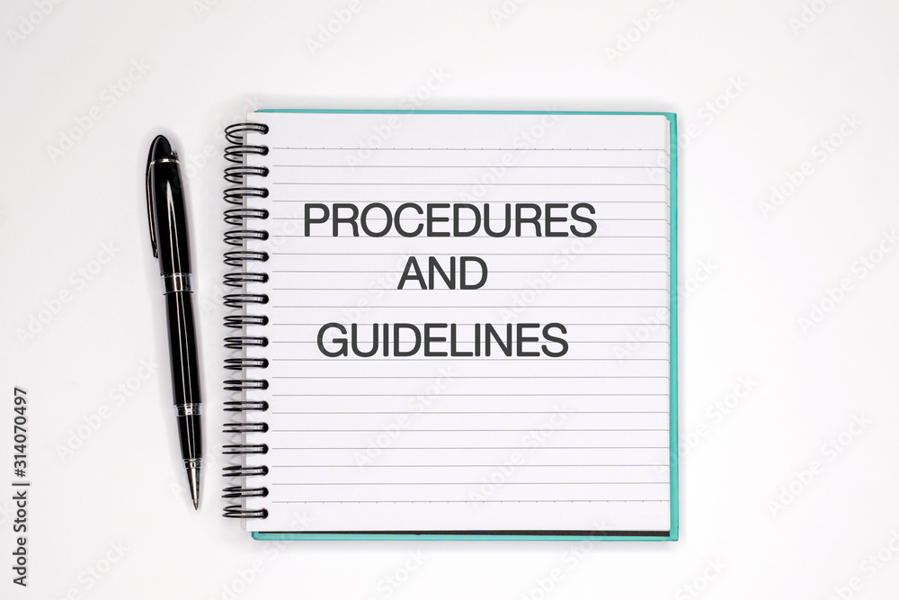 Procedures and guidelines text on note pad - Business concept Procedures and guidelines text on note pad - Business concept