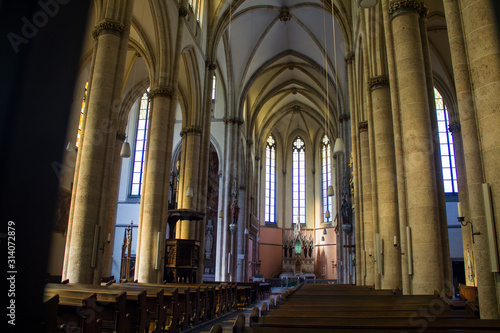 hall in a catholic temple, columns altar benches