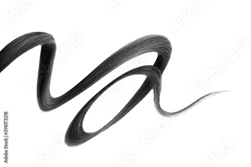 Black hair on white background, isolated. Thin curly thread