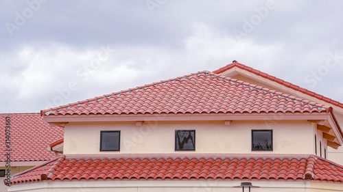 Panorama Tiled roof on a building with ventilation windows