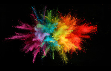 Explosion of colored powder isolated on black background