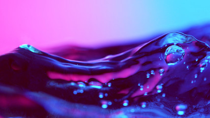 Detail of water waves in neon lights