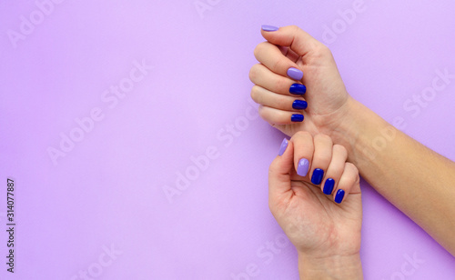 Stylish trendy women's manicure. Blue and lilac photo