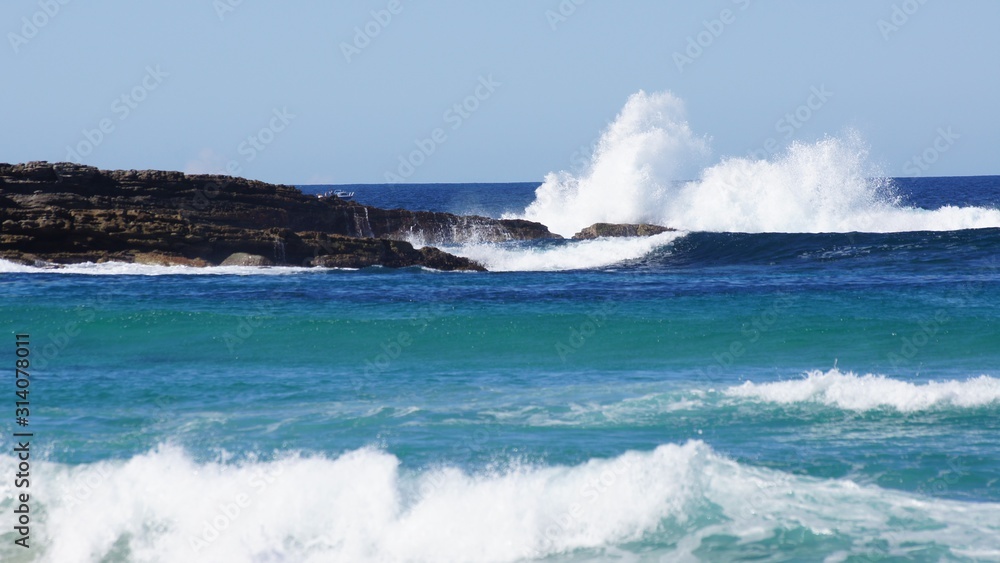 Fototapeta premium Waves hitting rock Australia