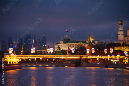 Moscow, Russia - January 03, 2020: View of the Moscow Kremlin and the Moskva river in the evening with Christmas illumination.