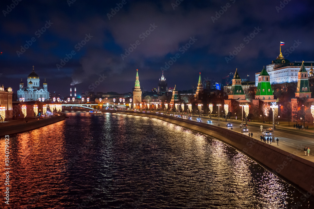 Moscow, Russia - January 03, 2020: View of the Moscow Kremlin, Moscow river and Kremlin embankment at the Christmas illuminations at night.
