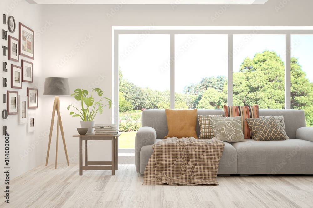Fototapeta premium Stylish room in white color with sofa and summer landscape in window. Scandinavian interior design. 3D illustration